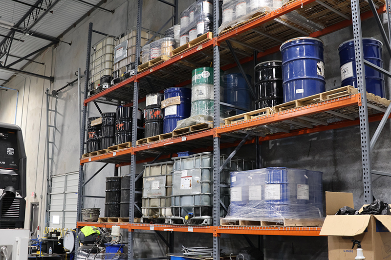 Lubricant Barrels Stored On Warehouse Racks - Applied Energy Company
